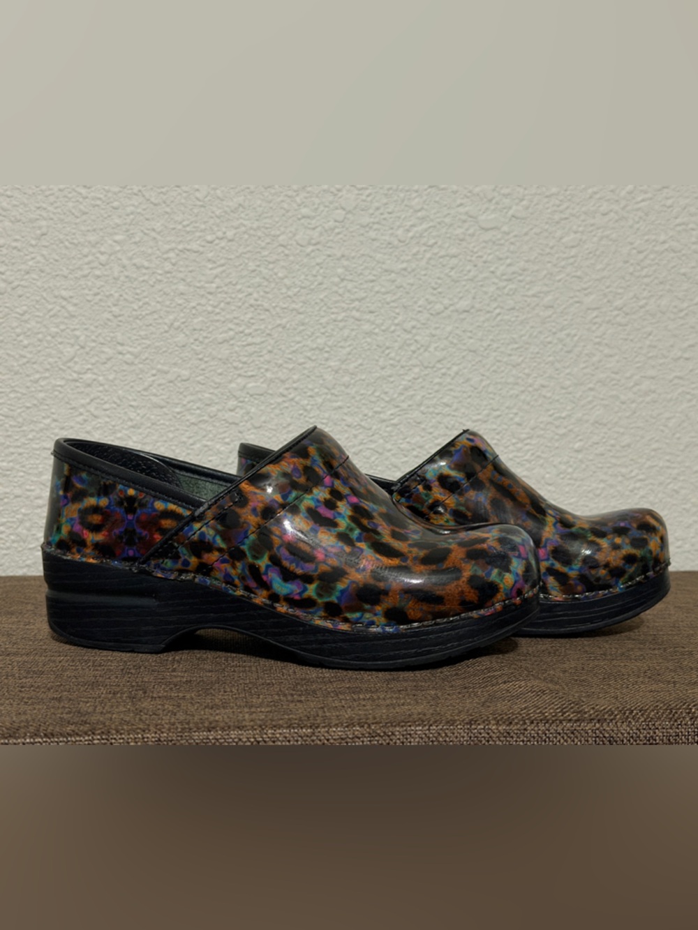 Women’s size 36 Dansko Multicolor Leopard-Print Patent Clogs with Black Sole